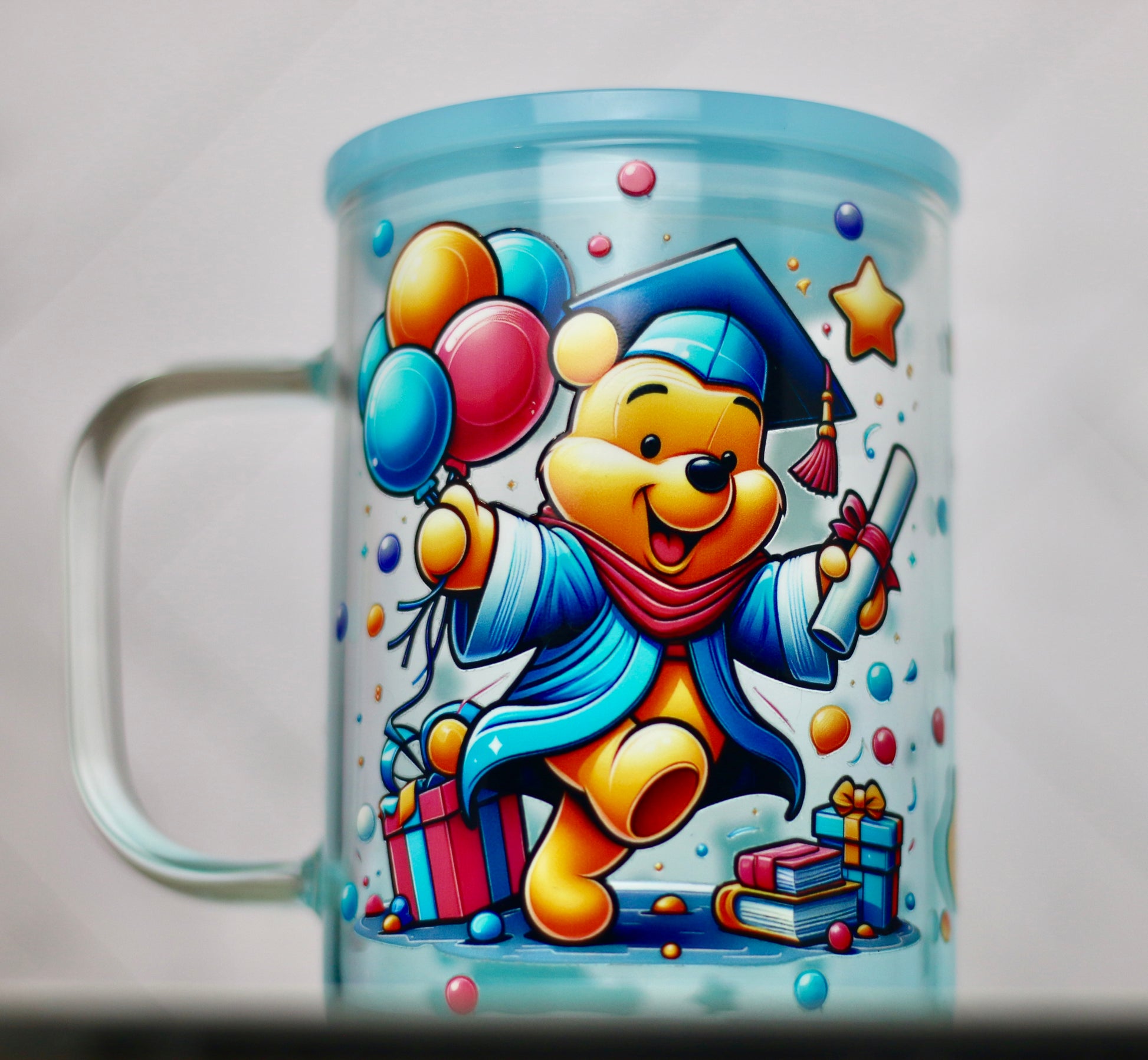 Blue yellow bear graduation mug with balloons and diploma design